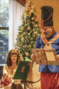 Characters from the Nutcracker reading a story to children.