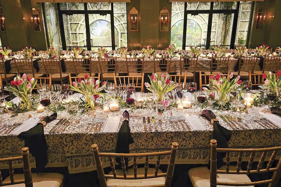 Hawkins Brown Room Two long tables, elegantly decorated, for a large group wine tasting.